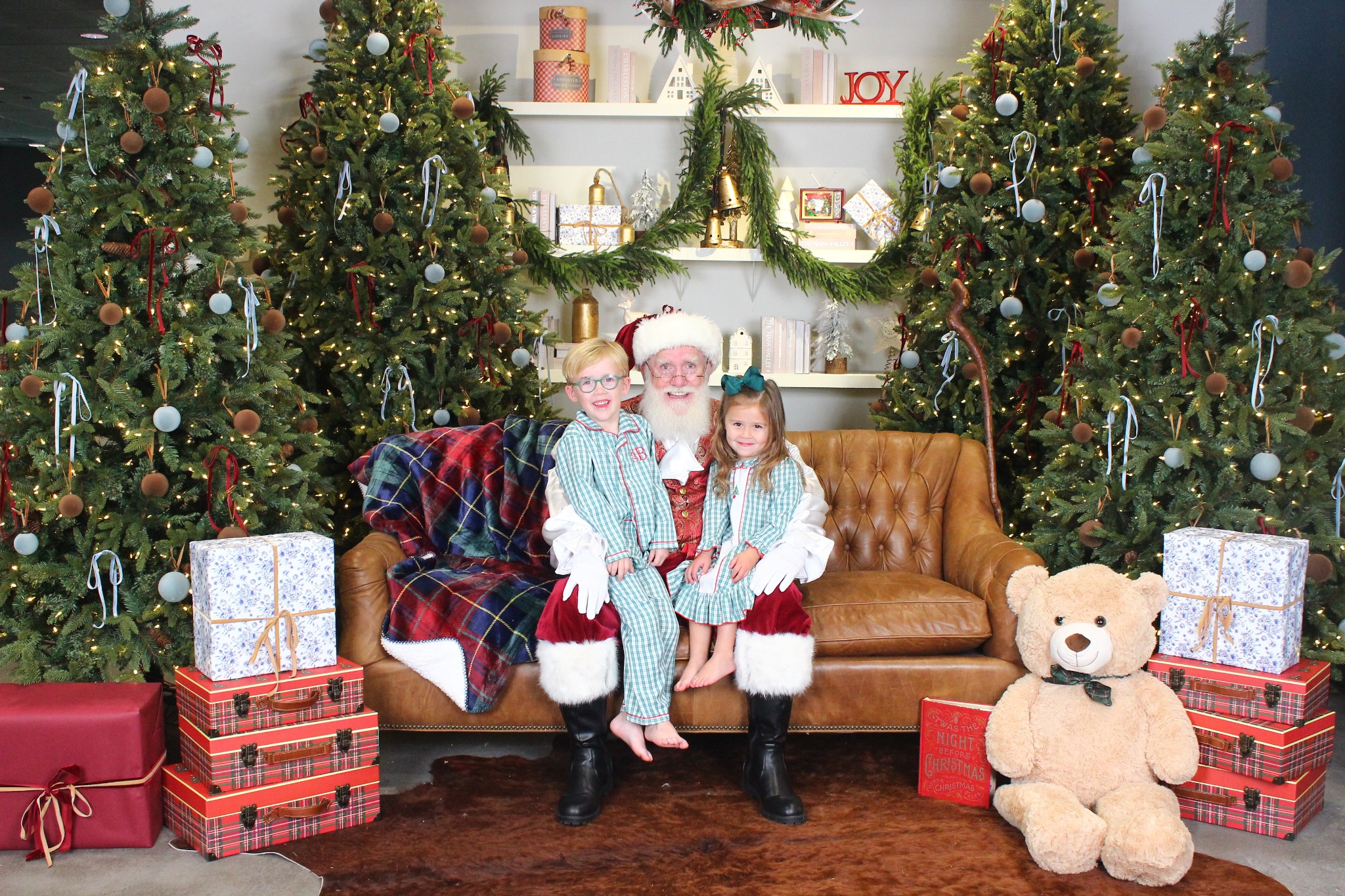 Santa smiling with two children