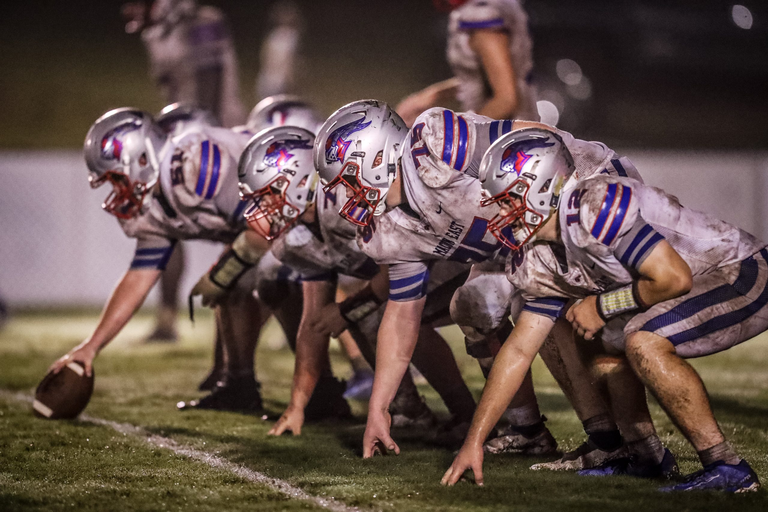 Football players lining up for a play